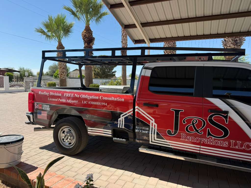 J&S Renovations red and white truck with company logo and phone number